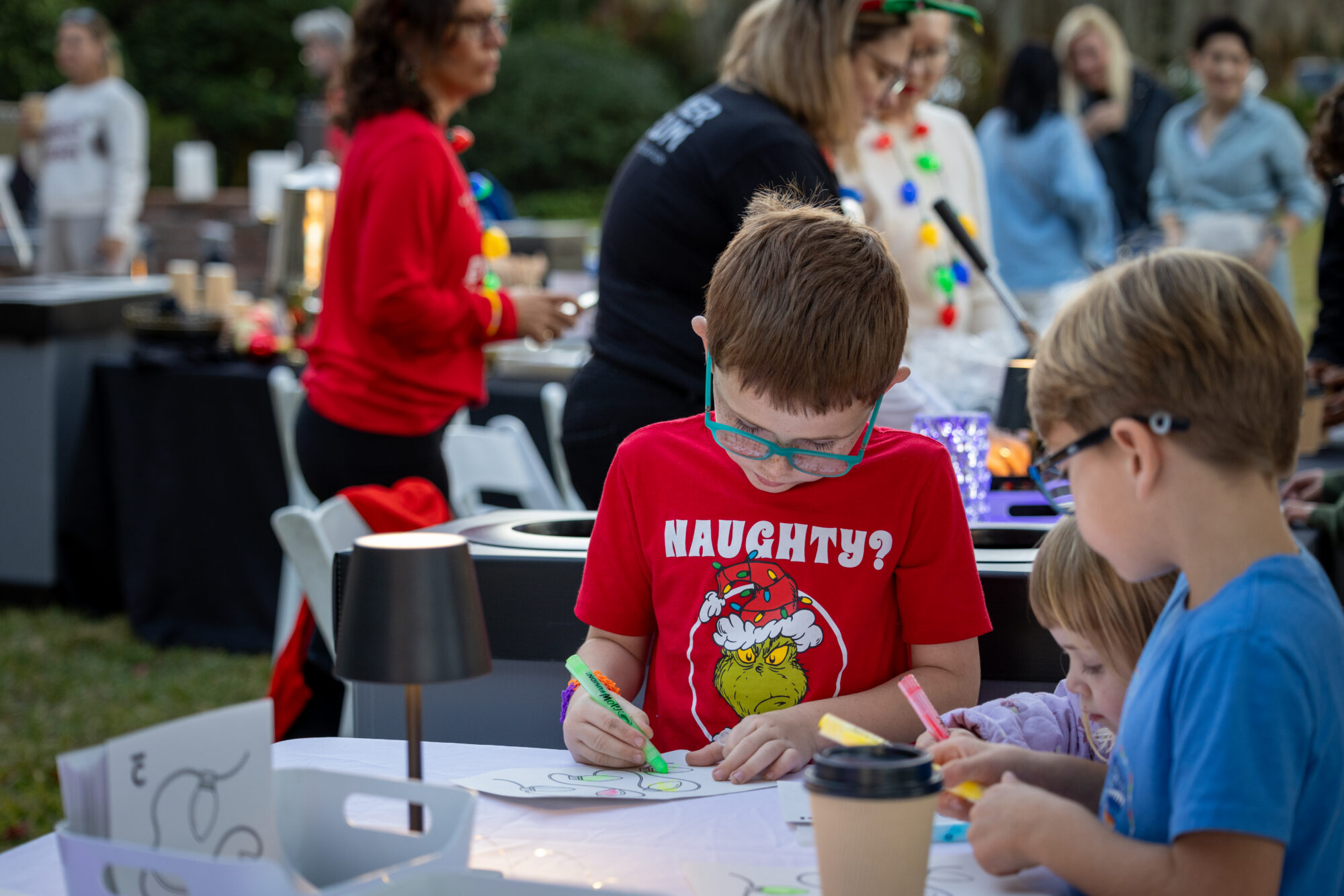 Children creating holiday artwork at Luminaria at the Cummer Museum.